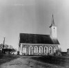 Tudulinna uus kirik. Vasakul vana puukirik, paremal hollandi tüüpi tuulik.. Autor: V. Raam. Aasta: 1986. #–