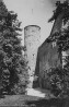 Kellatorn koonilise telkkatusega ja osa lossikiriku fassaadi. . Aasta: XX saj.algus. #N 5643/126