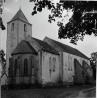 Kiriku üldvaade NO-st. Seina keskel kinnimüüritud N-portaal.. Autor: V.Raam. Aasta: 1984