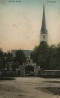 Ambla surnuaia värav, tagaplaanil kirik.. Aasta: ca 1915. aasta. #F 25010
